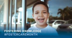 Smiling boy with text: Fostering Knowledge hashtag Foster Care Month