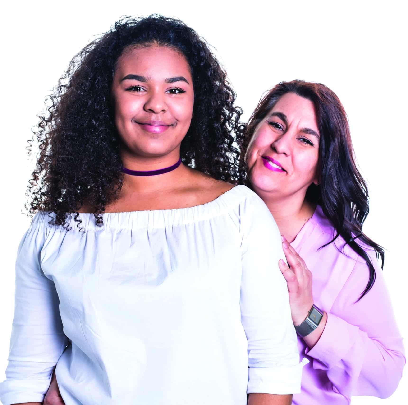 mother and her teenage daughter isolated on white A mother and her teenage daughter isolated on white